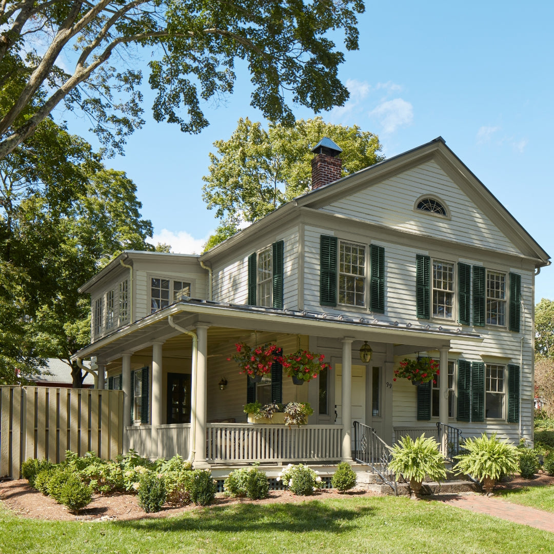 Home exterior painted in Benjamin Moore Halo with Essex Green shutters using Regal Select Exterior