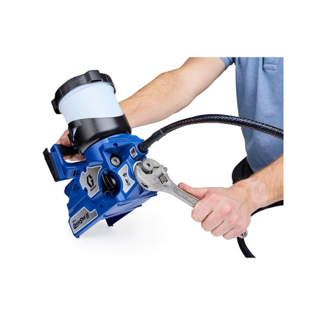 Contractor servicing inline filter on Graco Ultra QuickShot II cordless paint sprayer