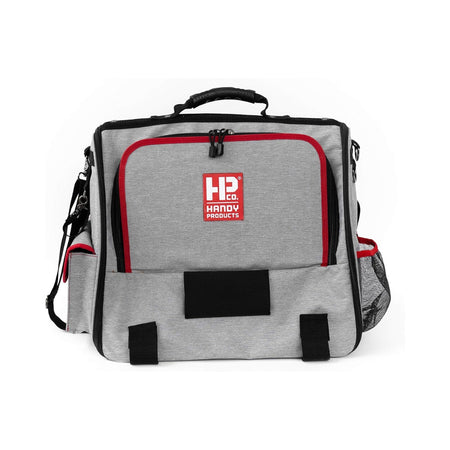 Interior compartments of Handy Painters Tool Bag Deluxe showing brush slots and red liner for organized storage.