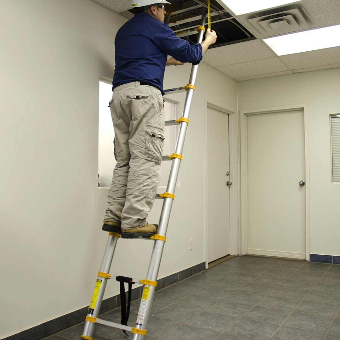 Contractor using the Metaltech telescopic ladder indoors to access ceiling area